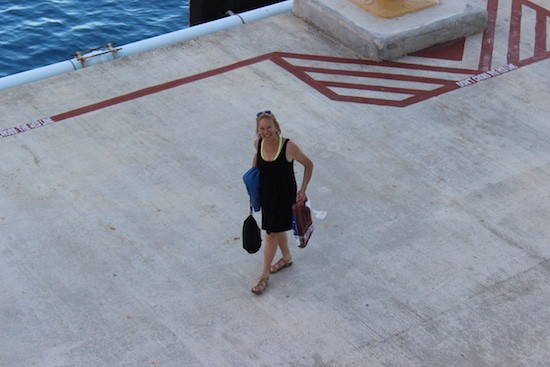 Sherry Laskin about the miss the ship in Cozumel. Notice the liquor in hand. 