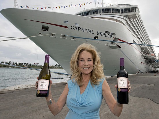 Kathie Lee Gifford, former spokeswoman for Carnival Cruise Line, shows off her GIFFT wines in front of the Carnival Breeze.