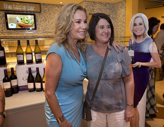 Kathie Lee with a guest aboard Carnival Breeze in Ocean Plaza.