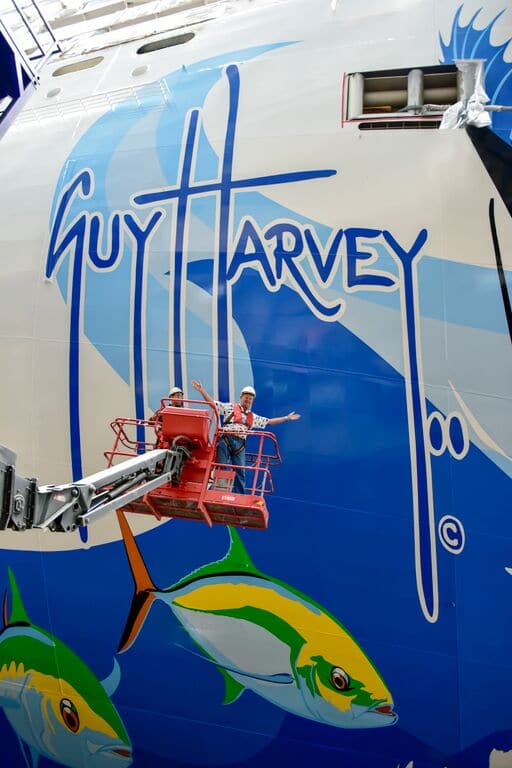 Guy Harvey painting the hull of Norwegian Escape.