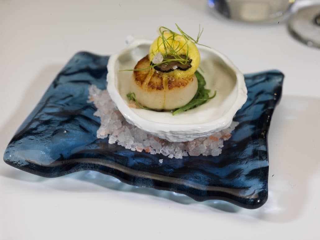 Amuse Bouche of Seared Scallops on Seaweed Salad and Light Saffron Vinaigrette Foam