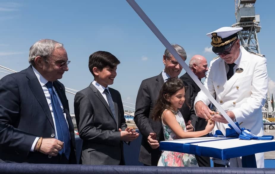 Captain Pier Paolo Scala cuts the ribbon with the Godmother