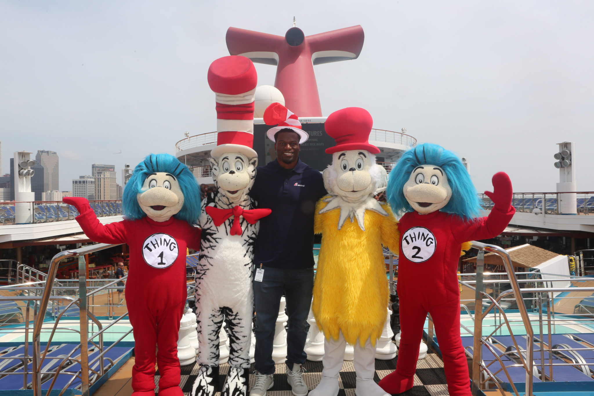 Ben Watson with some Dr. Seuss characters carnival