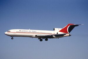 A Carnival Air Lines jet in flight with landing gear extended on a clear day, reminiscent of the vast adventure and excitement associated with cruise ships.