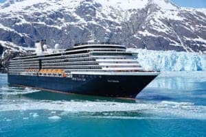 Exterior view of Holland America's Westerdam with the Alaska's glacier as the background