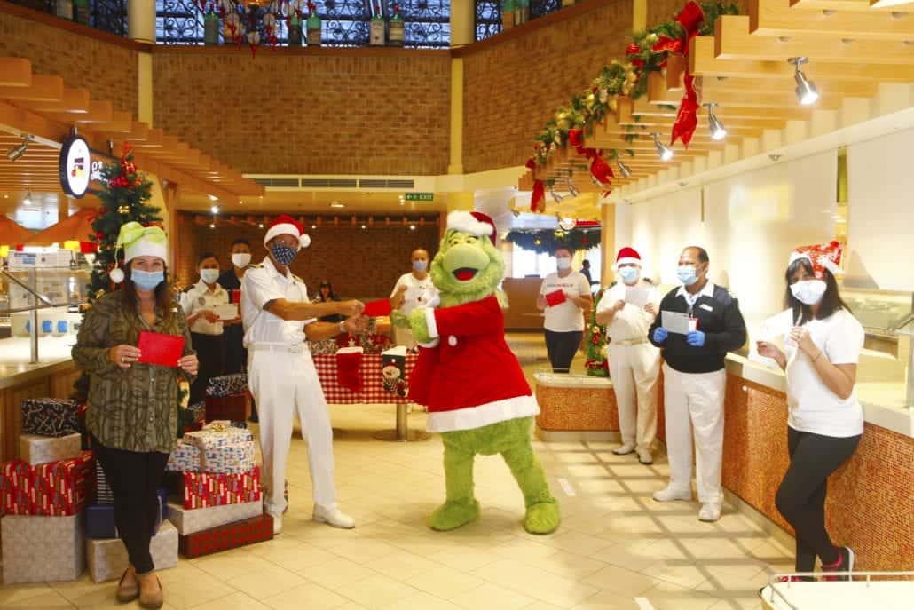 grinch delivering holiday cards carnival crew