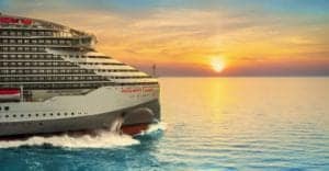 Virgin Voyages's Resilient Lady exterior view during sunset