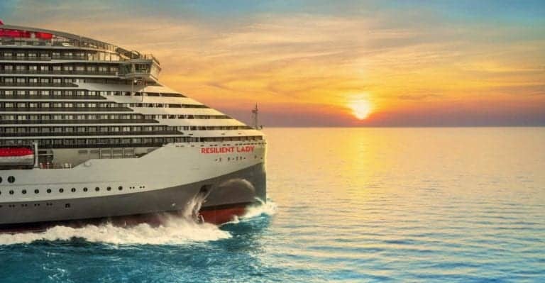 Virgin Voyages's Resilient Lady exterior view during sunset