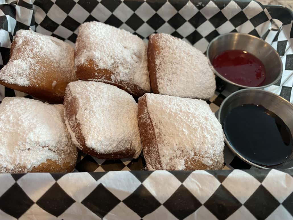 beignets carnival celebration emeril's bistro