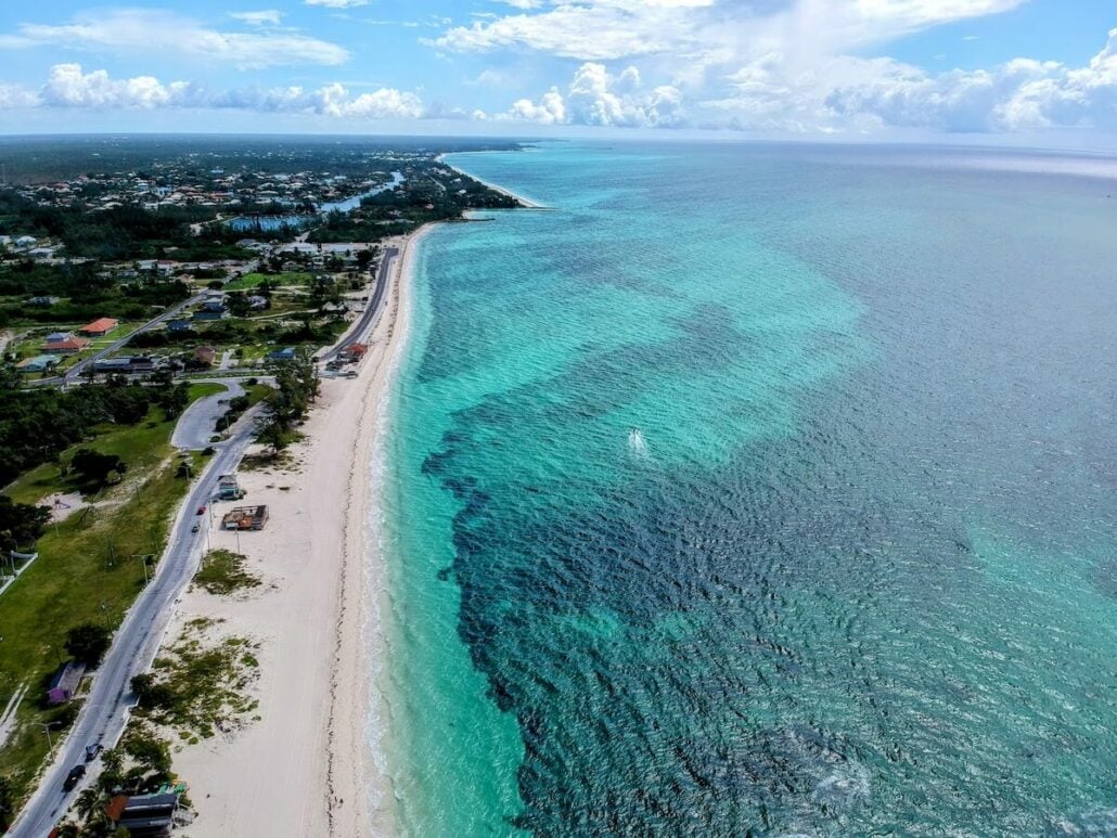 An aerial view of a beach and ocean in the Bahamas.