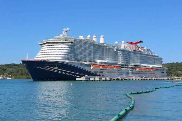 A Carnival Jubilee cruise ship docked at a Western Caribbean port.