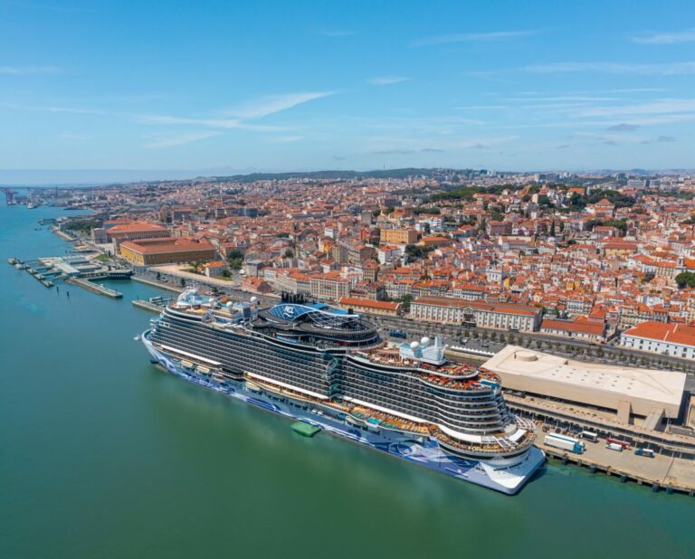 A Norwegian Cruise Line ship in a harbor.