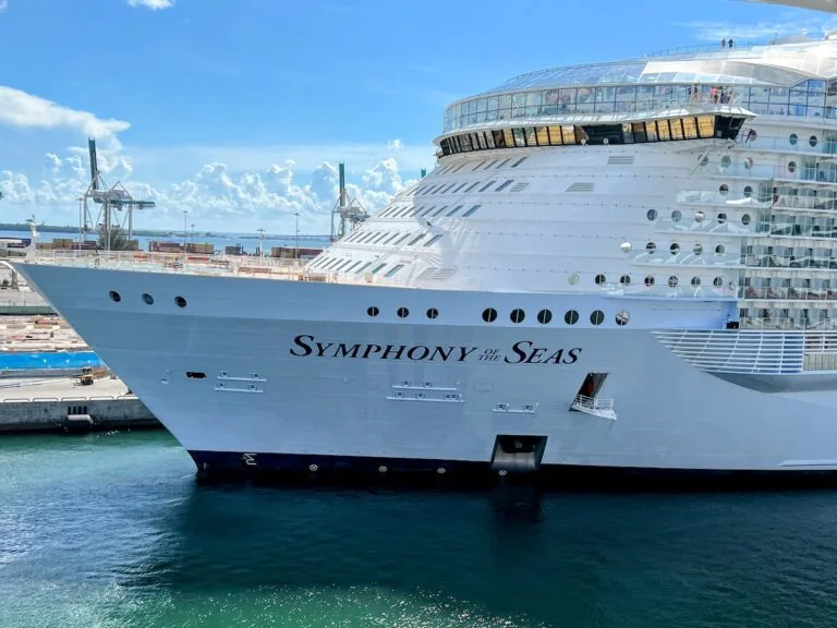 Symphony of the seas cruise ship docked at a dock.