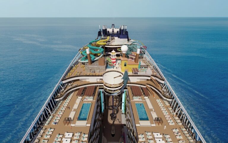 A cruise ship deck on MSC World America featuring pools, water slides, and various amenities, reminiscent of an outdoor park, with calm ocean waters in the background.