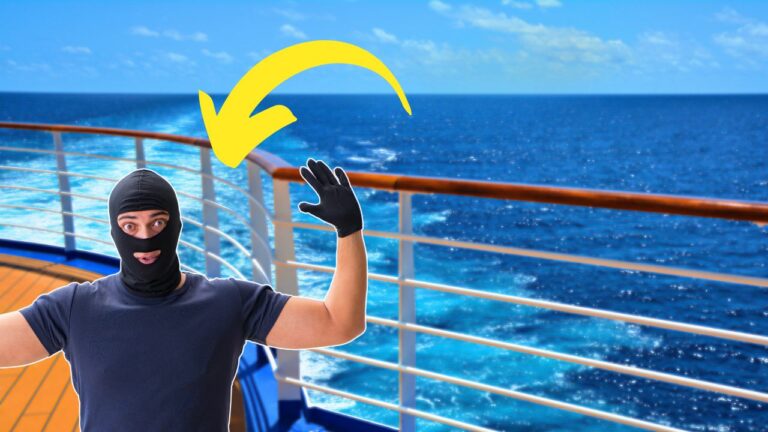 A person in a black balaclava and gloves is raising their hands on the deck of a cruise ship, with the ocean in the background and a yellow arrow pointing towards them.