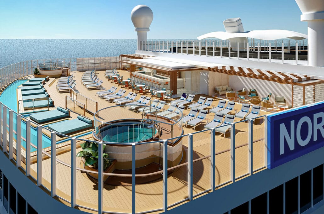 The outdoor deck of the Norwegian Encore boasts enhancements such as a pool, hot tub, loungers, sunbeds, and a bar, all overlooking the ocean.