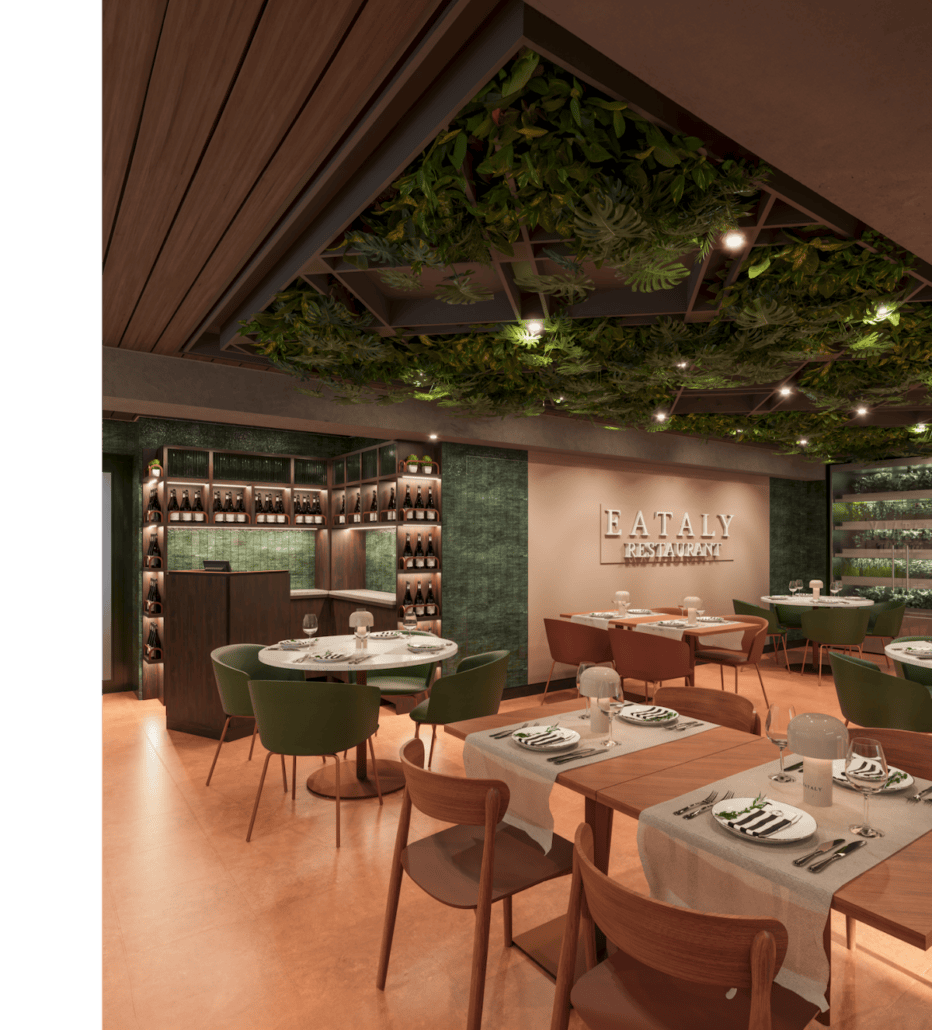 The interior of a modern restaurant aboard MSC World America features a green and wood theme. At Eataly at Sea, round and rectangular tables are set with white tablecloths, glasses, and napkins. Greenery hangs from the ceiling, while shelving with bottles is visible in the background. A sign reads "Eataly Restaurant.