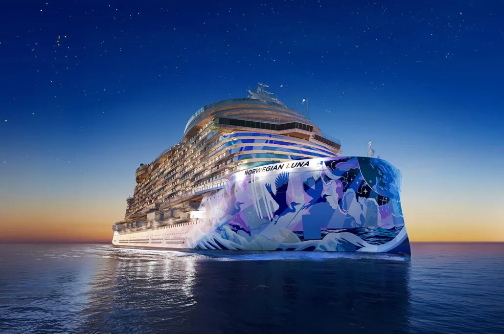 A large, illuminated cruise ship named "Norwegian Luna" sails on calm waters at twilight with a clear, starry sky in the background. The Norwegian Luna features vibrant artwork on its bow. RENDERING