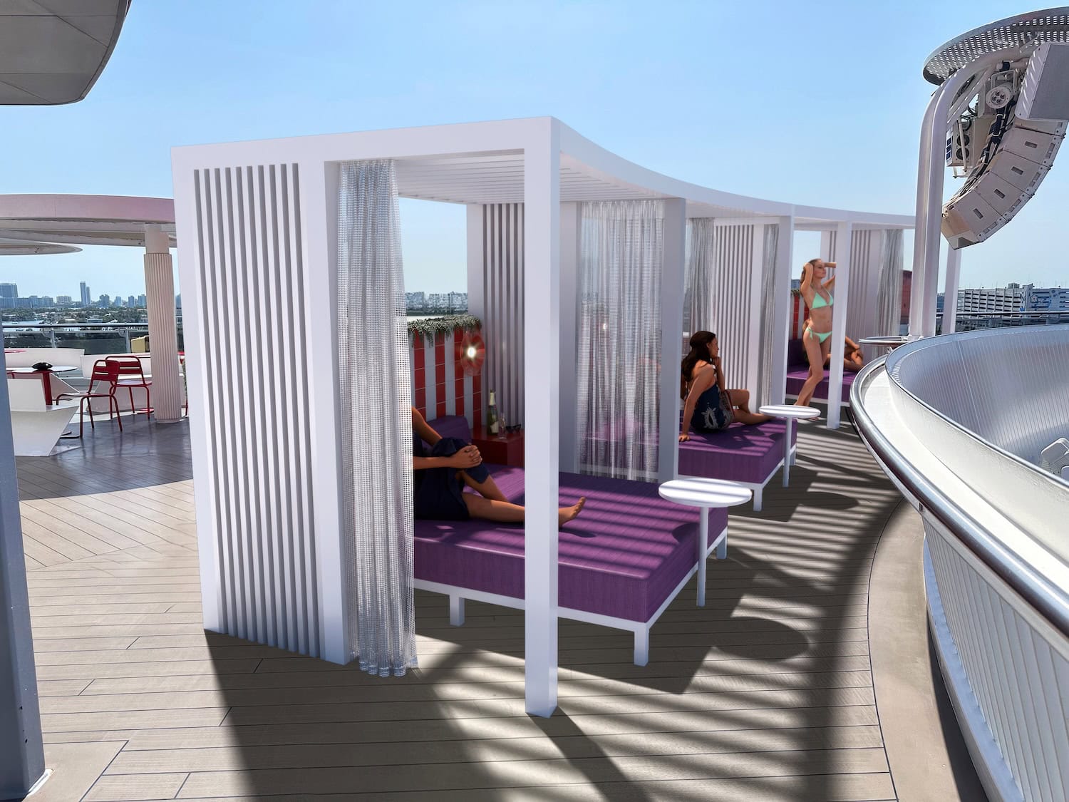 A rooftop terrace on a Virgin Voyages vessel features white cabanas with purple cushions and semi-transparent curtains. People are lounging inside the cabanas, enjoying the upgraded ambiance as they overlook a stunning city skyline in the background.