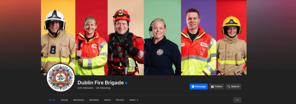 A group of six firefighters in various Dublin Fire Brigade uniforms stand against a colorful backdrop. The vibrant uniforms, differing in color and style, represent the essential roles each firefighter plays as they save lives and protect their community.