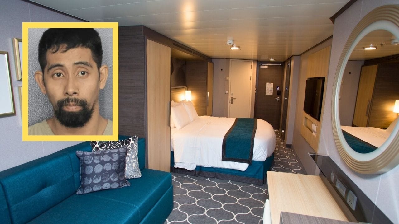 A Royal Caribbean cruise ship cabin featuring a double bed, a blue sofa with patterned pillows, a round mirror, and a TV. The decor showcases a grey and blue color scheme. In the corner, there's an inset image of an unidentified crew member.