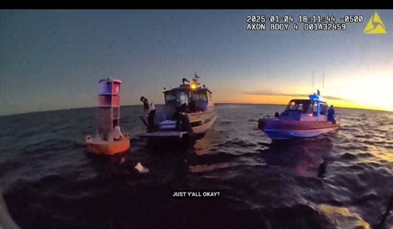 During sunset, two boats hover near a buoy in open water. One boat has flashing lights, hinting at a rescue mission. Several individuals are on board as the nearby cruise ship watches over them. A caption reads, "JUST Y'ALL OKAY?.