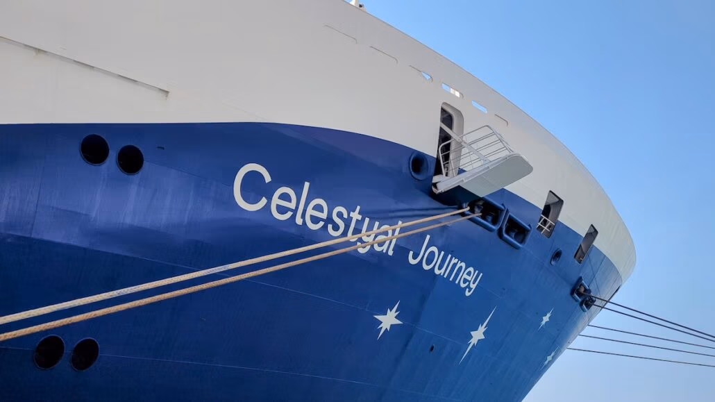 The image captures the bow of a midsize ship, its blue hull bearing the name "Celestyal Journey" amid starry motifs. Several ropes tether the docked vessel, perfectly poised under a clear blue sky—truly embodying why this Celestyal Journey feels perfect.