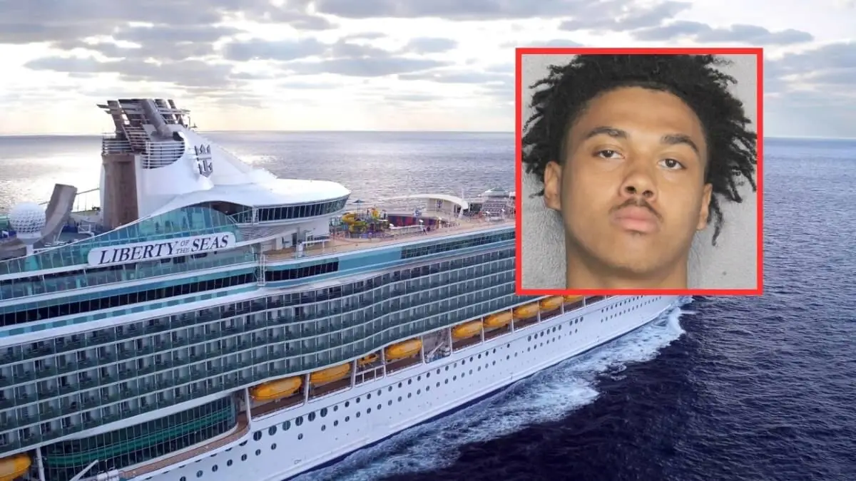A large cruise ship named "Liberty of the Seas" sails on the ocean, with an inset showing a young man with short curly hair and a neutral expression—reportedly a guest charged in connection to an elevator assault aboard the cruise ship.