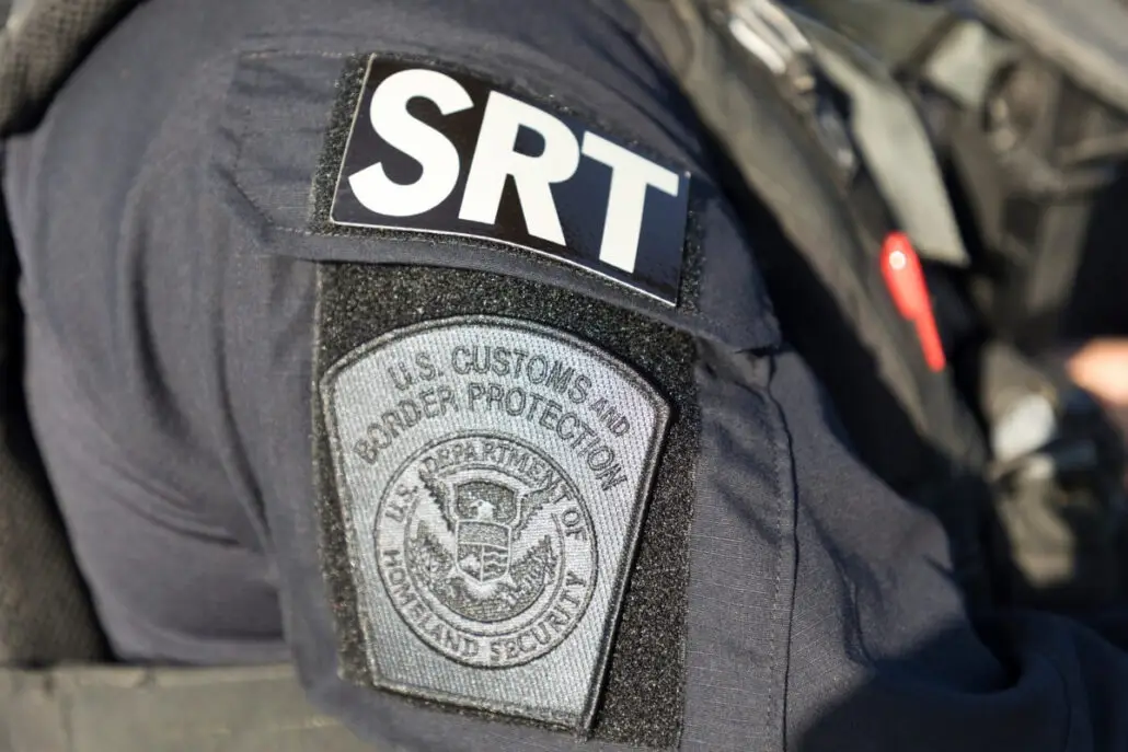 Close-up of a U.S. Customs and Border Protection uniform in Galveston, showing a patch with the agency’s emblem and “U.S. Department of Homeland Security,” often seen during cruise passenger arrest cases involving drugs in luggage.
