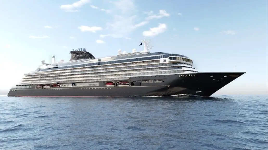 A large, modern cruise ship named Explora I from MSC Cruises sails on calm blue water under a clear sky with some clouds. The ship's black and white exterior features multiple decks, lifeboats, and offers an exclusive private island experience.