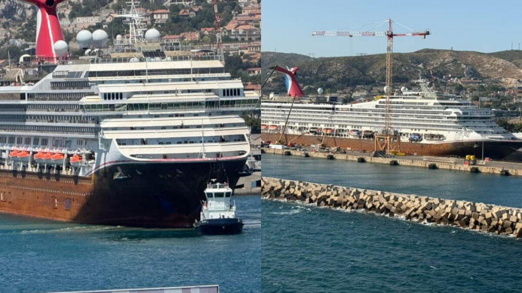 Two large cruise ships, including Carnival Liberty, are docked at a port with a tugboat nearby and a construction crane in the background. Hills and buildings lie in the distance, as news of a shipyard strike looms over the bustling harbor.