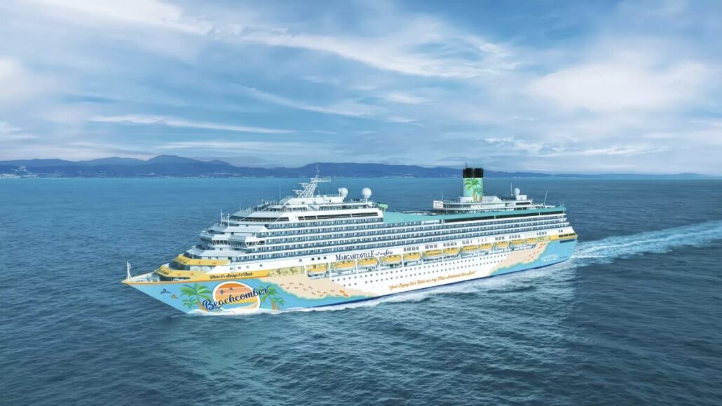 A large Margaritaville at Sea cruise ship decorated with colorful beach-themed graphics sails on calm blue water under a partly cloudy sky, with distant land visible on the horizon.