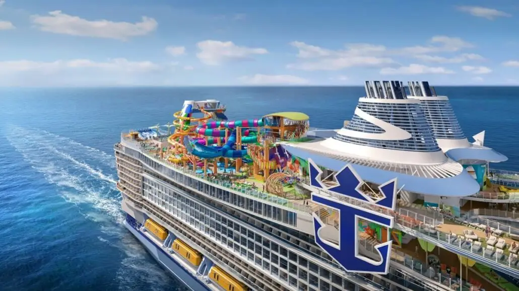 A large Royal Caribbean cruise ship sails on the ocean under a blue sky, featuring multiple colorful water slides, pools, and expanded dining options on its upper deck. The Legend of the Seas logo is visible on the side of the ship.
