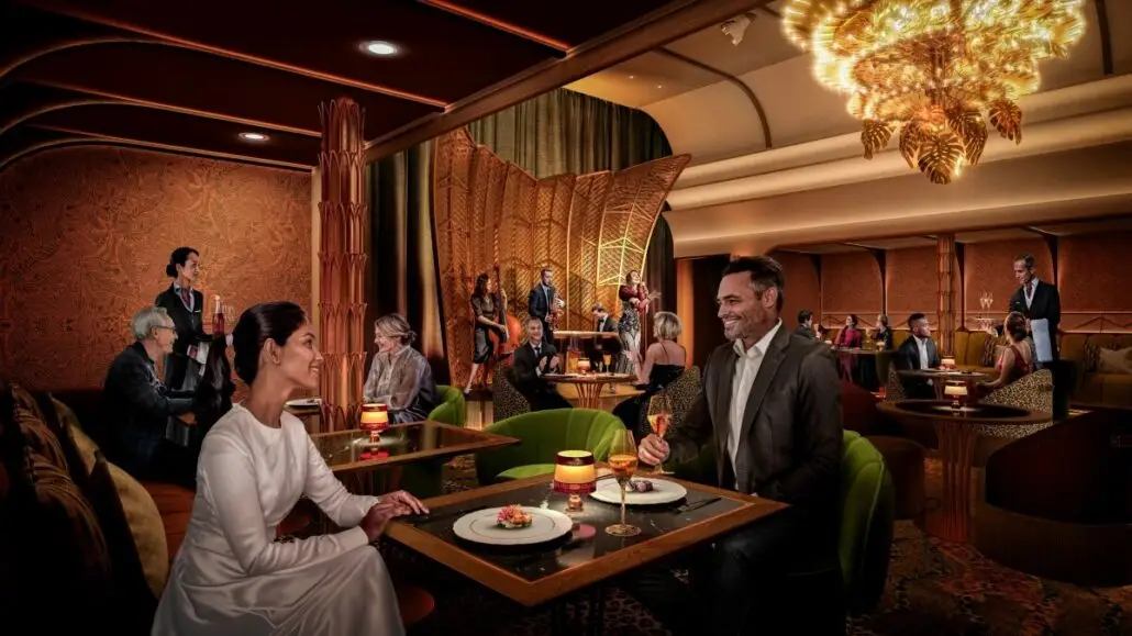 People in formal attire sit at tables in an elegant restaurant with expanded dining options, ornate lighting, and red and gold decor. Several waiters serve food and drinks as lively groups and couples enjoy conversation, reminiscent of Legend of the Seas’ classic ambiance.
