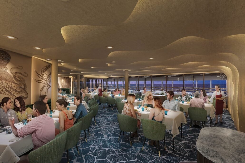 A busy restaurant with ocean-themed decor, featuring guests seated at tables, teal chairs, underwater murals, and large windows overlooking the water—perfect for experiencing Carnival Cruise Line’s new menus and vibrant new restaurants. A server carries food toward a table.