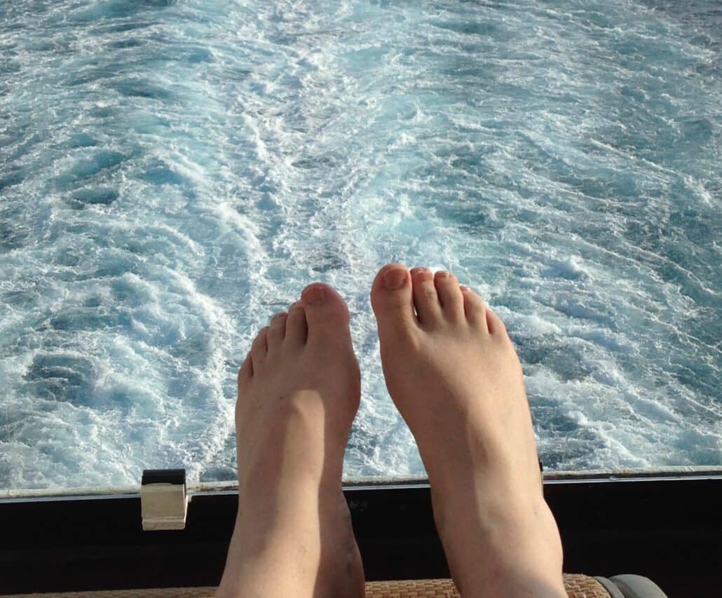 feet on the balcony of a cruise ship. Photo by Richard Simms/CruiseRadio