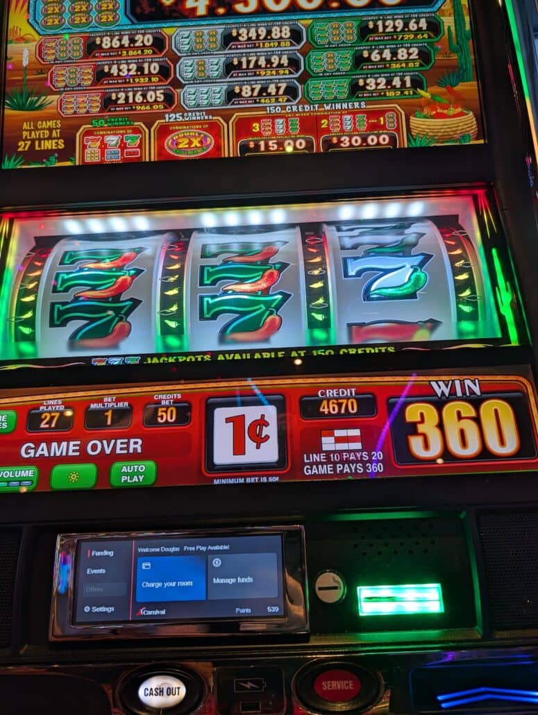 A close-up of a slot machine screen shows three sevens lined up—a classic winning combination for cruise gamblers. The display reveals a win of 360 credits, with the machine set to 1 cent, 27 lines, and a credit balance of 4,670. A panel at the bottom offers service options for cashing out or adjusting settings.