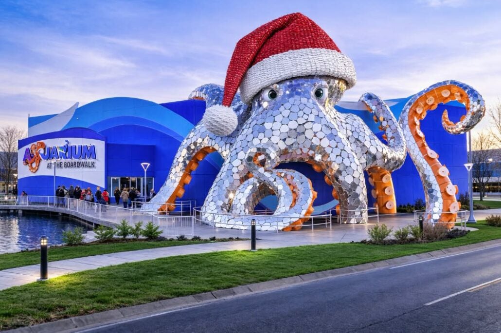 The Aquarium at the Boardwalk building features a large, silver sculpture of an octopus wearing a giant Santa hat, making it a festive stop for your Branson getaway.
